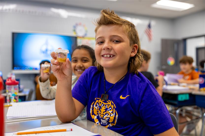 Students smile in science class